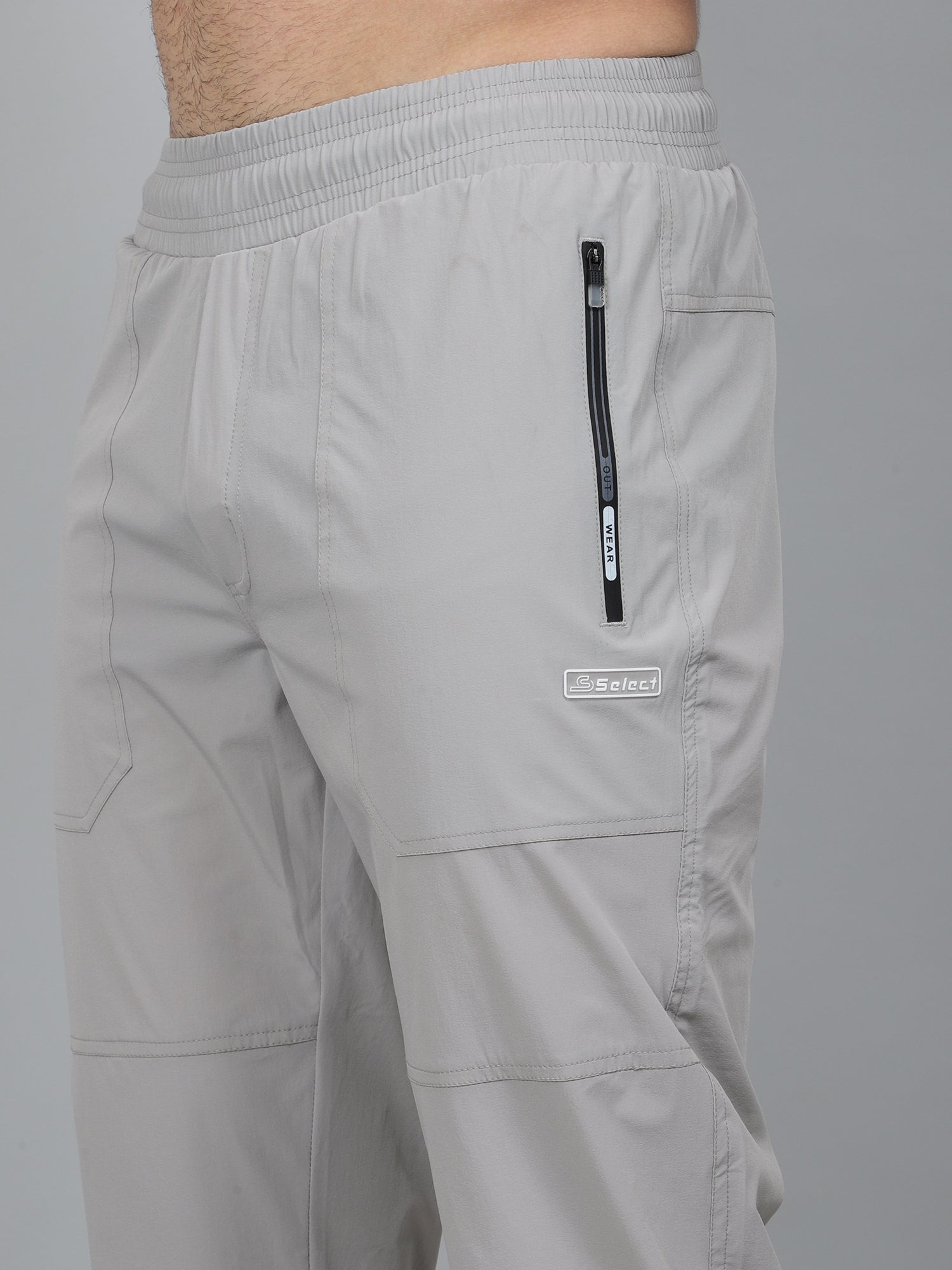 Gray pants with a zipper pocket on a gray background
