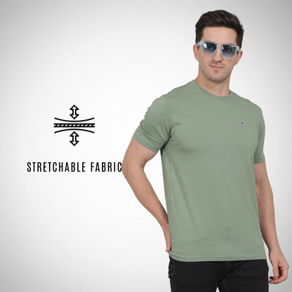 Man wearing a green t-shirt with sunglasses on a white background