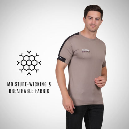 Man wearing a brown athletic shirt with black sleeves, standing against a white background.