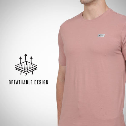 Person wearing a pink t-shirt with a breathable design feature highlighted on a white background