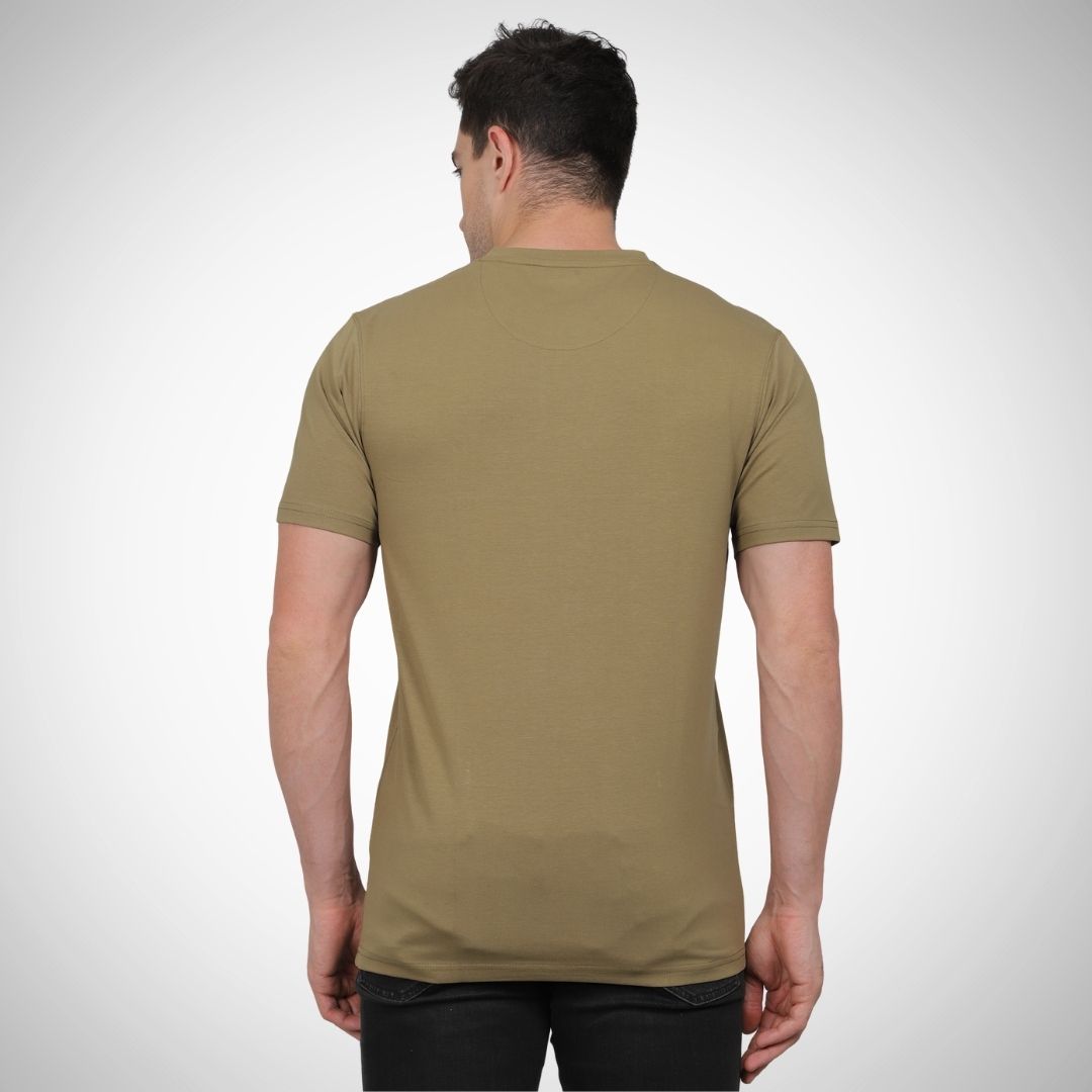 Man wearing a green t-shirt on a white background