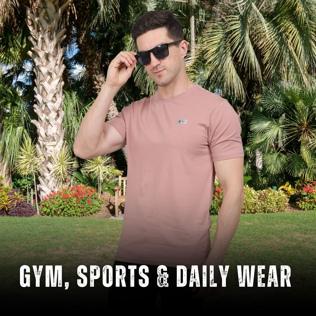 Man wearing a pink t-shirt with sunglasses in a garden setting, text 'GYM, SPORTS & DAILY WEAR' below.