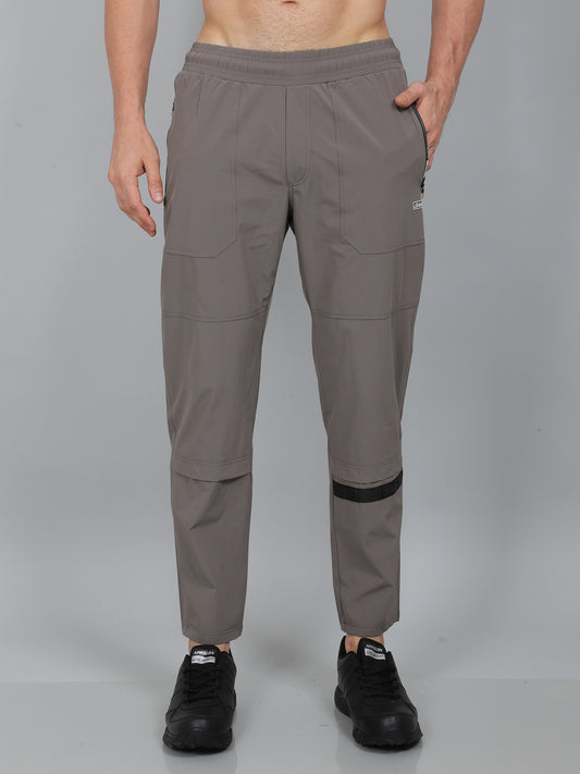 Person wearing gray pants on a gray background