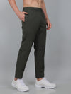 Person wearing black pants with a white background