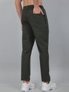 Person wearing dark green pants on a gray background